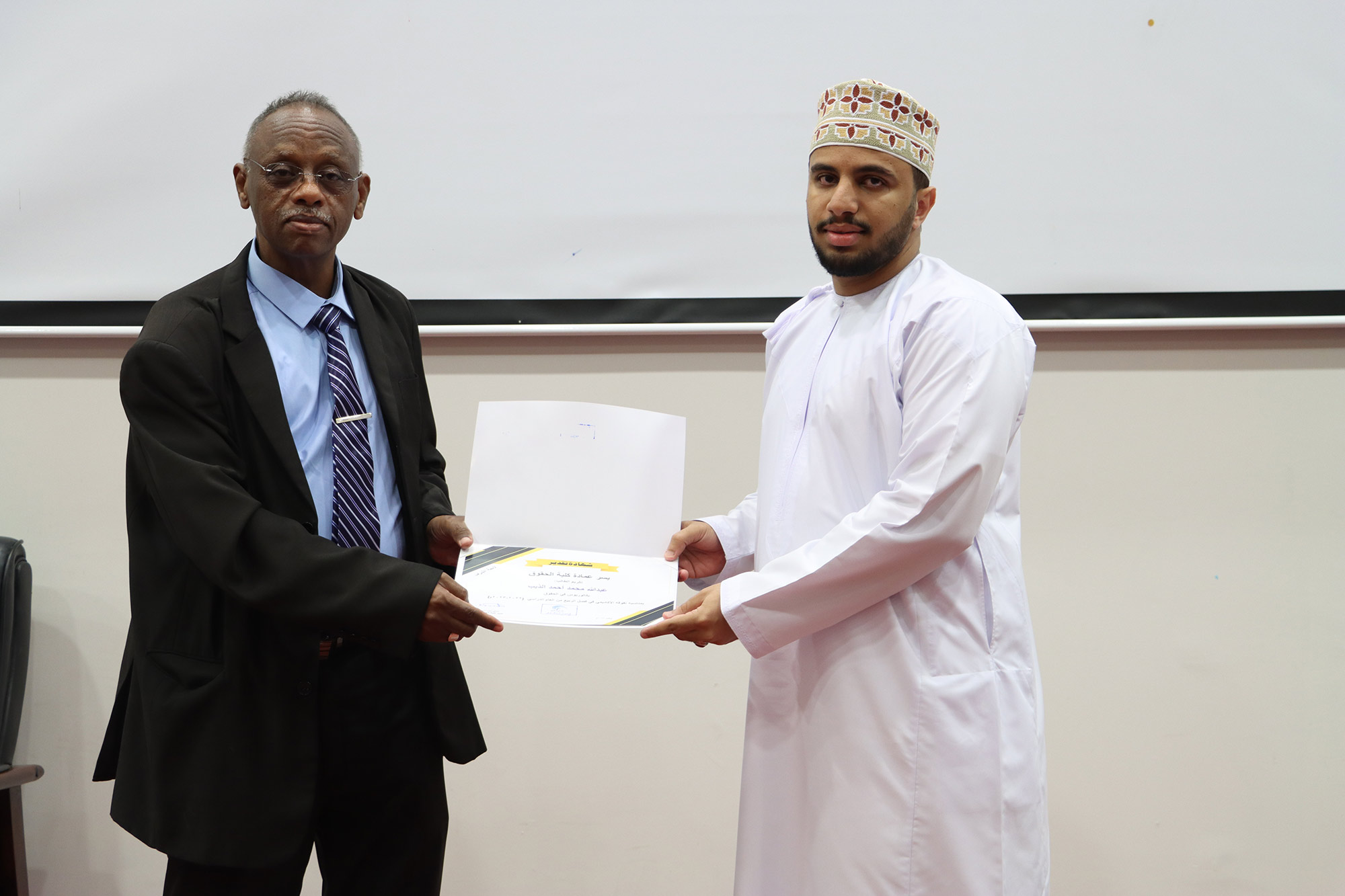 Dean of the College meeting with students and honoring the outstanding students